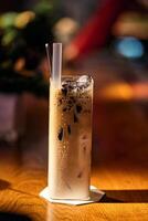 Ice chocolate in glass cups. Dark background with garland lights bokeh. Christmas and New Year sweet dfink and food holiday concept photo