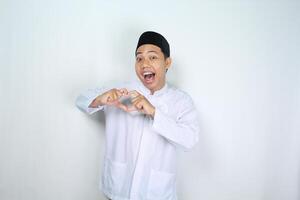 muslim asian man isolated on white background shouting while give heart shape photo