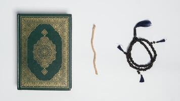 Muslim prayer equipment on white background photo