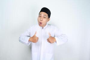 shocked asian man muslim show thumbs up isolated on white background photo