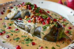 AI generated Mexican cuisine Chile en Nogada stuffed poblano chiles with creamy sauce, pomegranate seeds photo