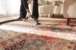 women cleaning with vacuum cleaner carpet, photo
