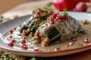 AI generated Mexican cuisine Chile en Nogada stuffed poblano chiles with creamy sauce, pomegranate seeds photo