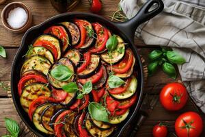 AI generated Traditional french Ratatouille with tomatoes, eggplant and zucchini, top view, copy space photo