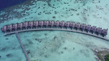 island in the Maldives with houses on the water video