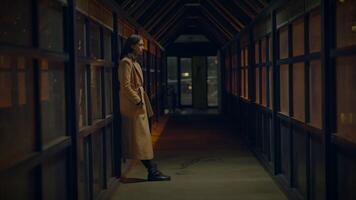 Sad Woman Thinking Hopeless and Lonely Inside Urban Hallway at Night Light video