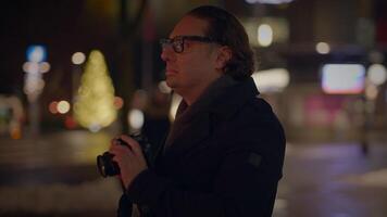 Street Photographer Capturing Pictures of People Traveling at Night video