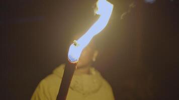 Young African Woman With Curly Hair Exploring Dark Night With Torch Light video