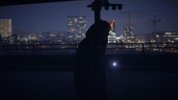 Hooded Fearless Woman Walking in Abandoned Urban Town at Twilight Light video