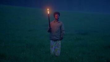 Fearless Female Person Holding Flaming Burning Torchlight Walking Outdoors video