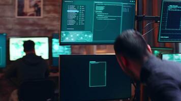 View of male hacker coding a dangerous virus to attack the government database. Cyber criminal. video