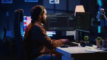 Programmer developing code on computer screen while in personal office using java programming languages. IT admin working with software tool, fixing database errors while working from home, camera A video