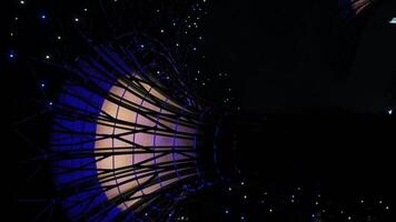 Vertical view to the supertree modern architecture tree design with light illumination while on light showing performance at Garden by the Bay famous desination in Singapore video