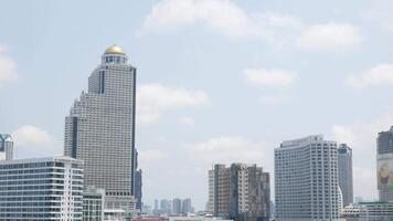 panorama landscape view of bangkok city skyline with many highrise skyscraper building in central financial distict in bangkok under sunny daytime video