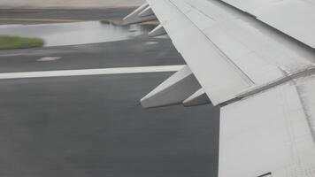 view from inside cabin of airplane aircraft while take off from runway in the airport video