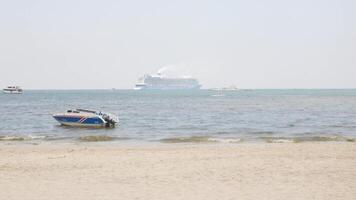 view to the ocean sea with giant cruise ship in the sea and some small ship,speedboat and jet ski water outdoor activity under summer holiday sunny sunshine sky daytime video