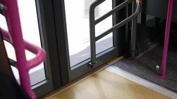 low angle view to the exit door gate of the bus while bus moving in singapore, singapore public transportation video