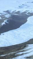 Snow covered mountain range seen from above video