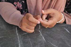 Young women hands suffering pain on finger photo