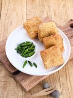 Tahu Bakso, Indonesian traditional snack made from tofu and beef. Served in white plate. photo