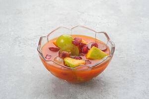 Asinan Buah or pickled fruit, Indonesian dessert made from preserved tropical fruits. Spicy, sweet and sour taste. photo