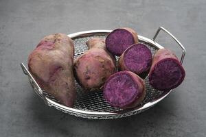 Steamed Purple Sweet Potatoes or ubi ungu photo