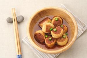 Gohyong or Ngo Hiang, made from minced chicken with flour, served with sour sauce photo