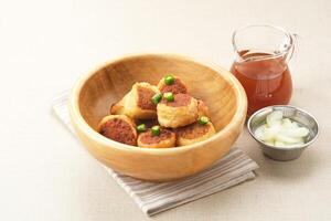 Gohyong or Ngo Hiang, made from minced chicken with flour, served with sour sauce photo