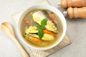 Pindang serani, fish soup with sour and spicy salty spices. Indonesian Food photo