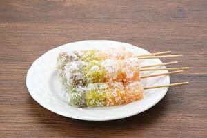 Sentiling or ongol-ongol, Indonesian traditional snack, made from cassava sprinkled with grated coconut photo