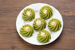 Kue Kaswi Pandan, traditional cake made from tapioca flour and pandan leaf, topping with sesame seed photo