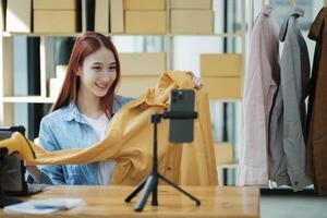 Entrepreneur Showcasing Clothes for Online Store photo