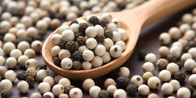 AI Generated White Peppercorn Heap In Wooden Spoon Closeup. Dry Pepper Pile. Top View Of Spicy Flavoring. Organic Seasoning. photo