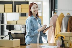 Confident woman portrait entrepreneur at ecommerce fashion or warehouse looking at camera. photo