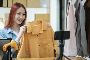 Entrepreneur Showcasing Clothes for Online Store photo