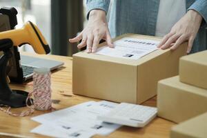 Scanning Barcode on Shipping Box with Scanner photo