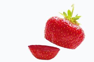 Sliced strawberries. Single strawberry fruit isolated on white background, with clipping path photo