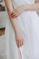 tender hands of a young woman with an expensive ring and a beautiful manicure. Close-up photo of female hands