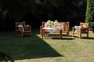 Elegant garden furniture on the terrace of a country house. Wooden wicker garden furniture. Beauty and peace near the house. photo