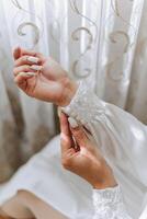 tender hands of a young woman with an expensive ring and a beautiful manicure. Close-up photo of female hands