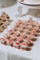 Candy bar at a wedding. Delicious desserts. Beautiful decorations. Fruits. Sweet cakes on your holiday. Birthday. Sweet life. photo