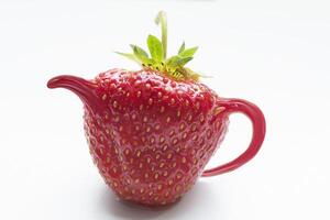 Strawberry teapot manipulation - white background photo