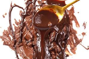 Sweet melted chocolate background with golden spoon.Mass of chocolate. photo