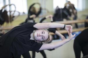 The girl is engaged in fitness. Choreography lesson photo