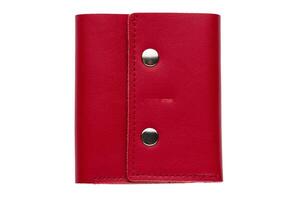 Red leather purse on a white background close-up.Compact wallet photo