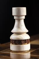Chess white rook wooden piece. A puzzle game with tricky combinations that requires planning and thinking. photo