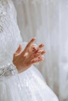 tender hands of a young woman with an expensive ring and a beautiful manicure. Close-up photo of female hands