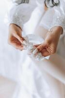 tender hands of a young woman with an expensive ring and a beautiful manicure. Close-up photo of female hands