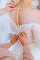 close-up of female hands touching dress. Women's manicure. A luxurious wedding ring on a woman's finger. photo