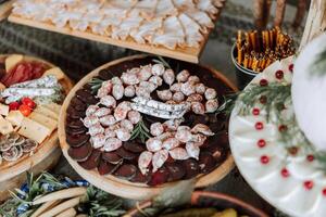 Meat and cheese snacks on the buffet. A buffet in a closed room, at a wedding celebration or birthday. Sandwiches on skewers before the start of the holiday. photo